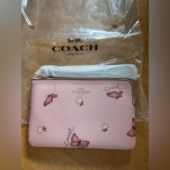 Coach Handbags - Coach Pink Floral and Butterfly Women's Wristlet
